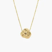 Layered gold necklace with multiple delicate chains.