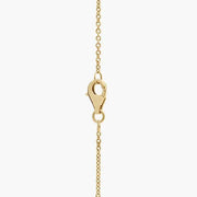 Gold snake necklace with flexible chain and shiny texture.