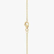 0.49 Ct gold pendant necklace with delicate chain and charm.
