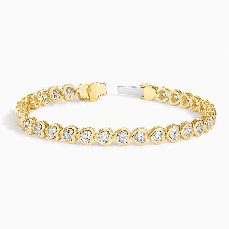 Heart Shaped Lab Diamond Bezel Tennis Bracelet in 14k Yellow Gold Plated