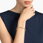 Diamond bracelet for women with round diamonds in white gold setting.