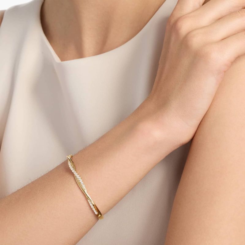 Twisting Moissanite Diamond Bangle In 14k Yellow Gold Plated