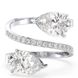 Whispering Pear & Round Moissanite Solitaire Ring