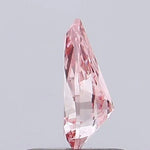 vivid pink colour pear cut pink lab grown diamond with brilliant facets on a light gray background.
