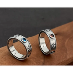Matching black gold couple rings with sleek modern design for urban couples.