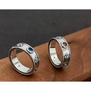 Matching black gold couple rings with sleek modern design for urban couples.