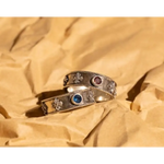 Matching black gold couple rings with sleek modern design for urban couples.