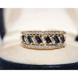 Luxury lab created gemstone ring with emerald cut green stone and diamond accents