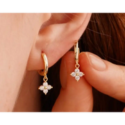 gold hoop earrings with stylish gold nugget earrings detailing and luxurious everyday jewelry appearance.