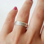 Minimalist sterling silver couple ring set, sleek design ideal for modern partners.