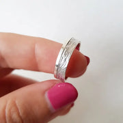 Minimalist sterling silver couple ring set, sleek design ideal for modern partners.