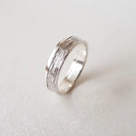 Minimalist sterling silver couple ring set, sleek design ideal for modern partners.