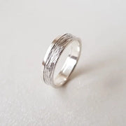 Minimalist sterling silver couple ring set, sleek design ideal for modern partners.