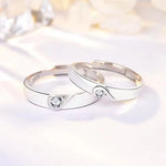 Romantic rose gold couple rings with intertwined hearts, symbol of unity.