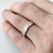 Infinity design couple rings symbolizing eternal love, crafted in sterling silver.
