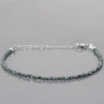 gold cuban bracelet and gold engraved bracelet paired with natural raw diamond bracelet 