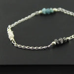 bracelet gold and solid gold bracelet with blue diamond uncut and luxury jewelry display.