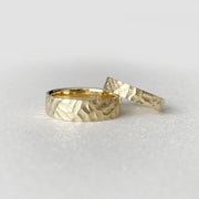 Dual-tone couple rings with modern geometric patterns for stylish partners.