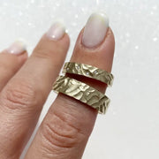 Dual-tone couple rings with modern geometric patterns for stylish partners.