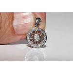 Round halo pendant with lab grown diamond center and green gemstone accents in vintage design