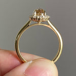 pear cut yellow diamond ring with round diamond halo 