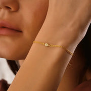 ruby tennis bracelet paired with diamond bracelets womens fashion jewelry and sparkling luxury finish.