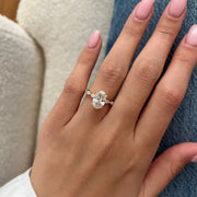 2 carat oval shape lab grown diamond ring with brilliant cut center stone in a classic engagement ring setting