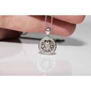 Round halo pendant with lab grown diamond center and green gemstone accents in vintage design
