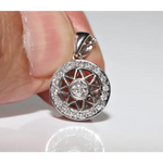 Round halo pendant with lab grown diamond center and green gemstone accents in vintage design