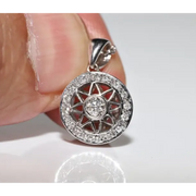 Round halo pendant with lab grown diamond center and green gemstone accents in vintage design