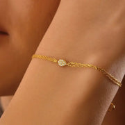 ruby tennis bracelet paired with diamond bracelets womens fashion jewelry and sparkling luxury finish.