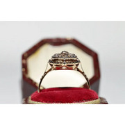 Unique lab grown diamond engagement ring with cushion cut stone in modern gold design