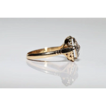Unique lab grown diamond engagement ring with cushion cut stone in modern gold design
