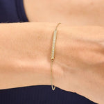 ruby tennis bracelet paired with diamond bracelets womens fashion jewelry and sparkling luxury finish.