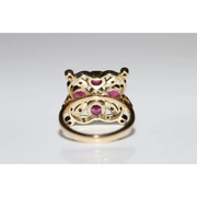 Lab created gemstone diamond ring with pink center stone and sparkling white diamonds in gold setting