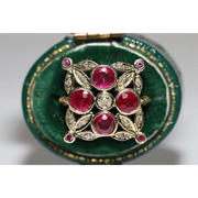 Lab created gemstone diamond ring with pink center stone and sparkling white diamonds in gold setting