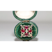 Lab created gemstone diamond ring with pink center stone and sparkling white diamonds in gold setting