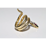 Stylish lab created gemstone ring with ruby red center stone and white diamond halo