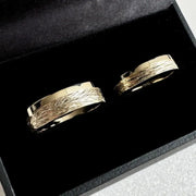 Minimalist sterling silver couple ring set, sleek design ideal for modern partners.
