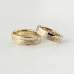 Minimalist sterling silver couple ring set, sleek design ideal for modern partners.