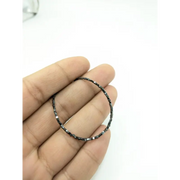 raw uncut diamond engagement rings with loose raw diamonds and raw gems for sale displayed beside gold 
