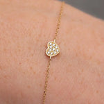 Gold bead bracelet with hand chain bracelet styling and elegant bracelets gold bracelets layering look.