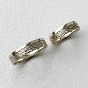 Minimalist sterling silver couple ring set, sleek design ideal for modern partners.