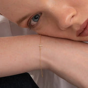 0.60 ct lab grown diamond bracelet for women featuring round brilliant stones in a gold setting.