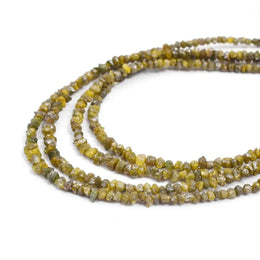 yellow diamond beads, how does a raw diamond look like, how to know if a rock is a diamond, natural diamond raw black diamond in rock