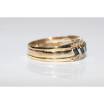 Luxury lab created gemstone ring with emerald cut green stone and diamond accents