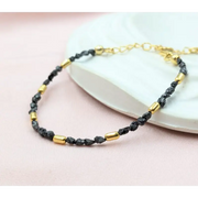 gold bracelet with beads and gold snake bracelet inspired by uncut stones and value collections.