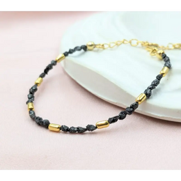 gold bracelet with beads and gold snake bracelet inspired by uncut stones and value collections.