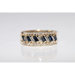 Luxury lab created gemstone ring with emerald cut green stone and diamond accents