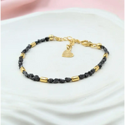 gold bracelet with beads and gold snake bracelet inspired by uncut stones and value collections.